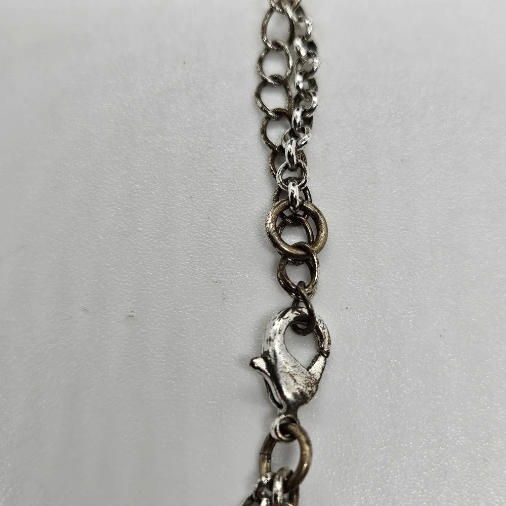 T&R silver tone leaf bib necklace